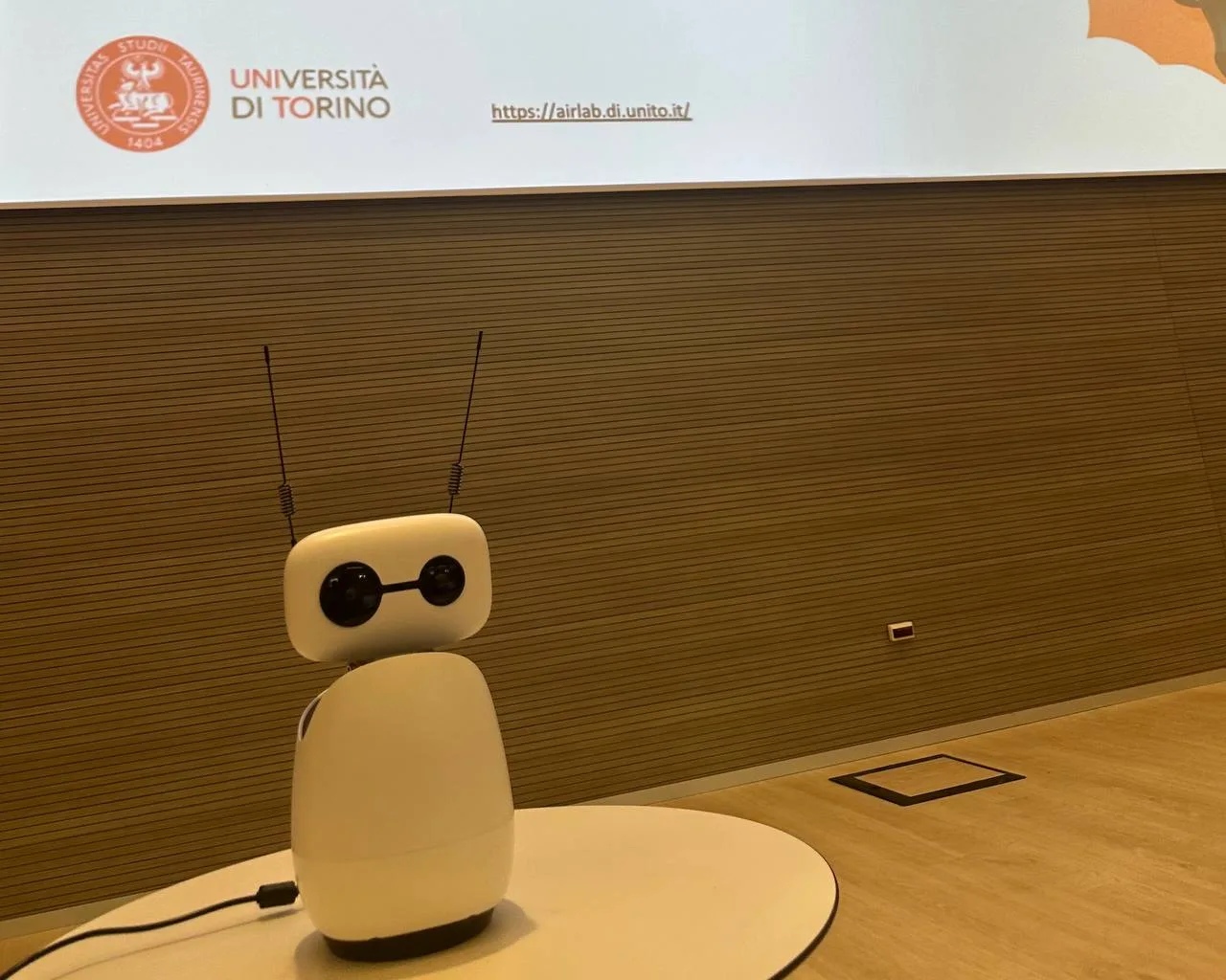 Reachy Mini robot on a table at AIRlab, UniTo